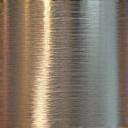 A gleaming, smooth metallic surface reflecting light, representing recycled stainless steel or brass used in sustainable razors.